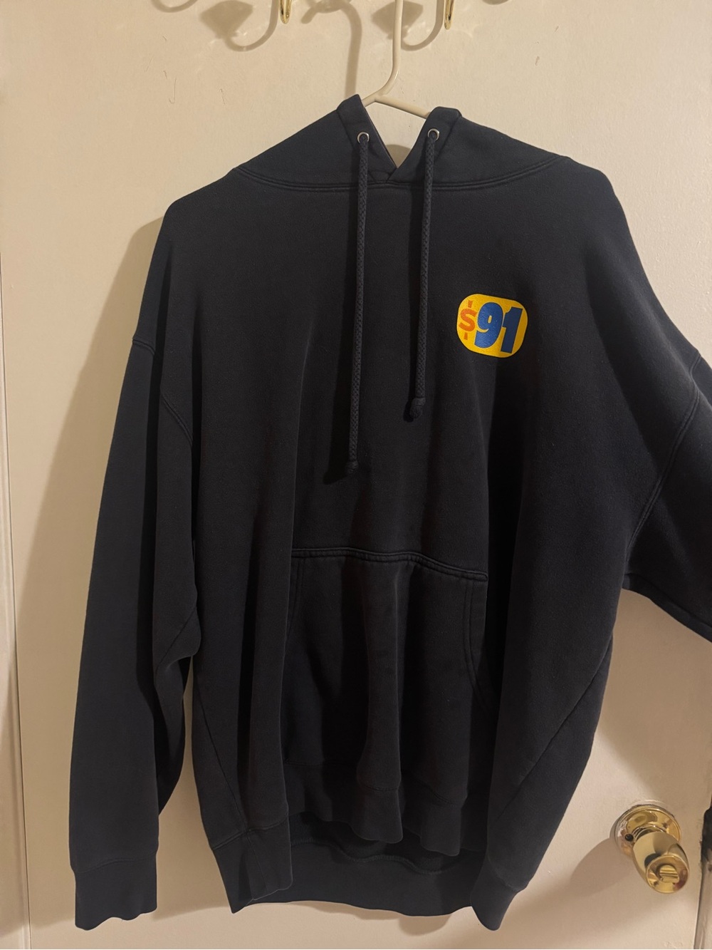 Black Pullover Hoodie with Yellow & Blue '91 Patch